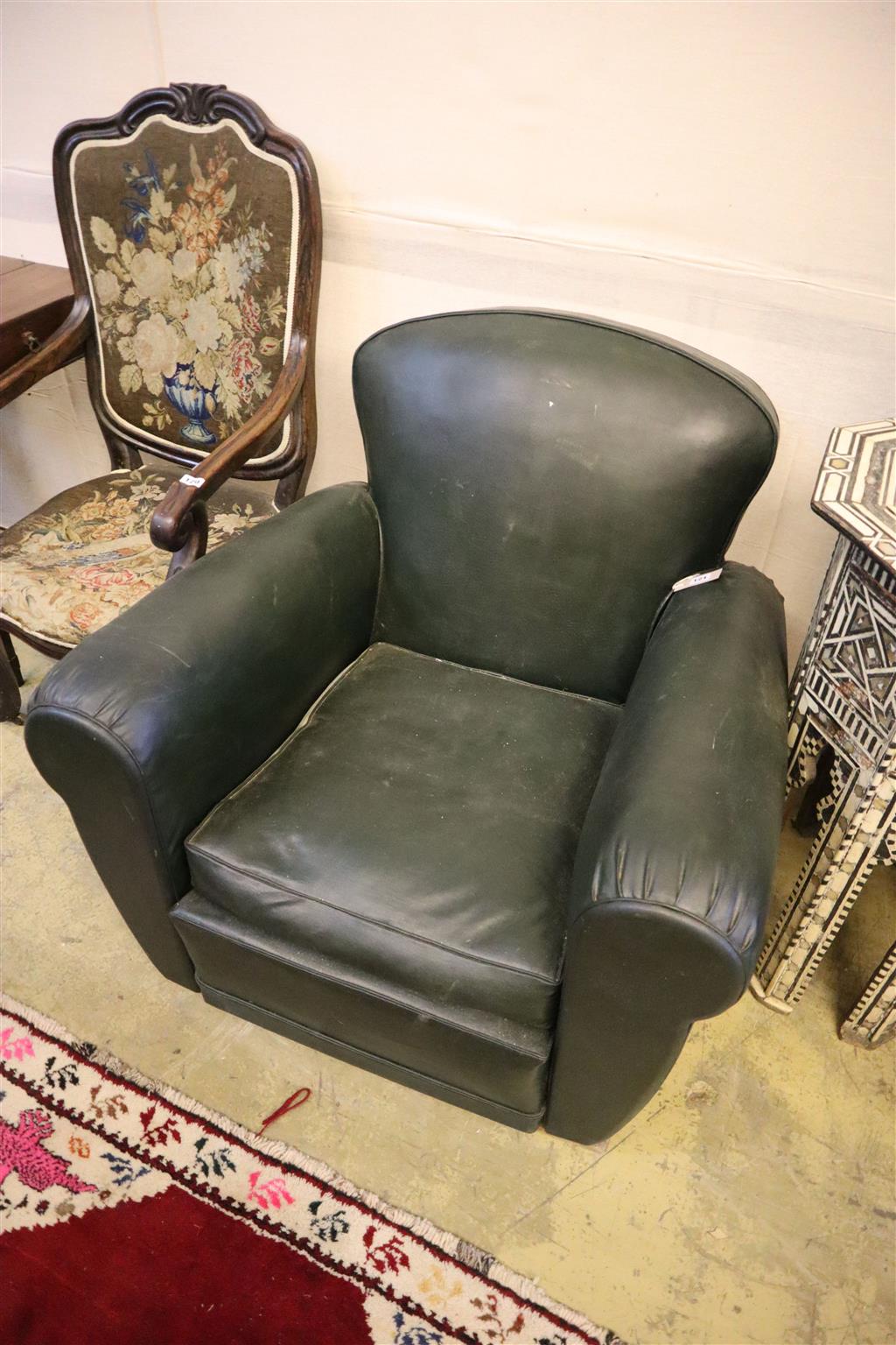 A deco style green leatherette armchair